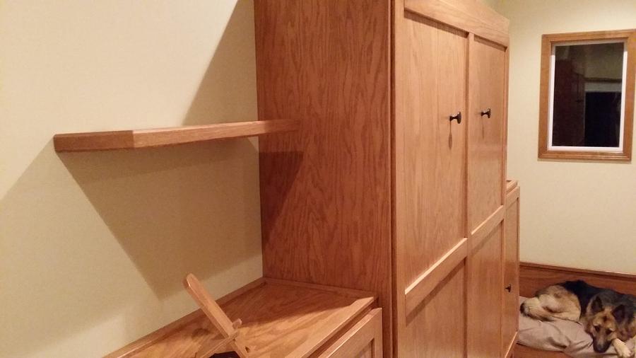 Murphy bed, cabinets, and floating shelves