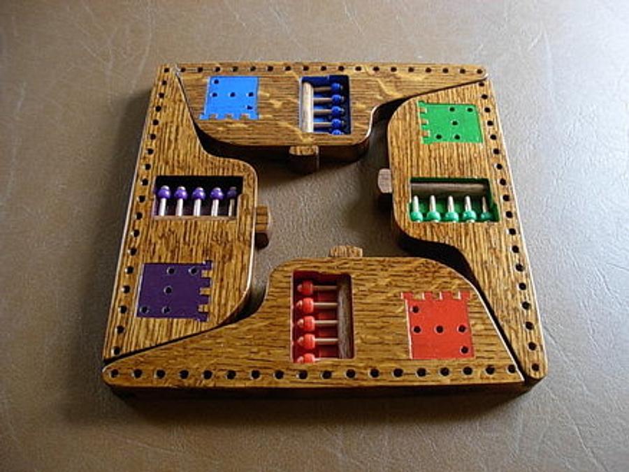 Self Storing Pegs and Jokers Game