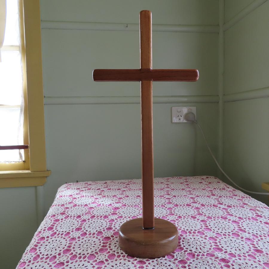 CROSS ON A BASE FOR AN OLD LADY IN A NURSING HOME
