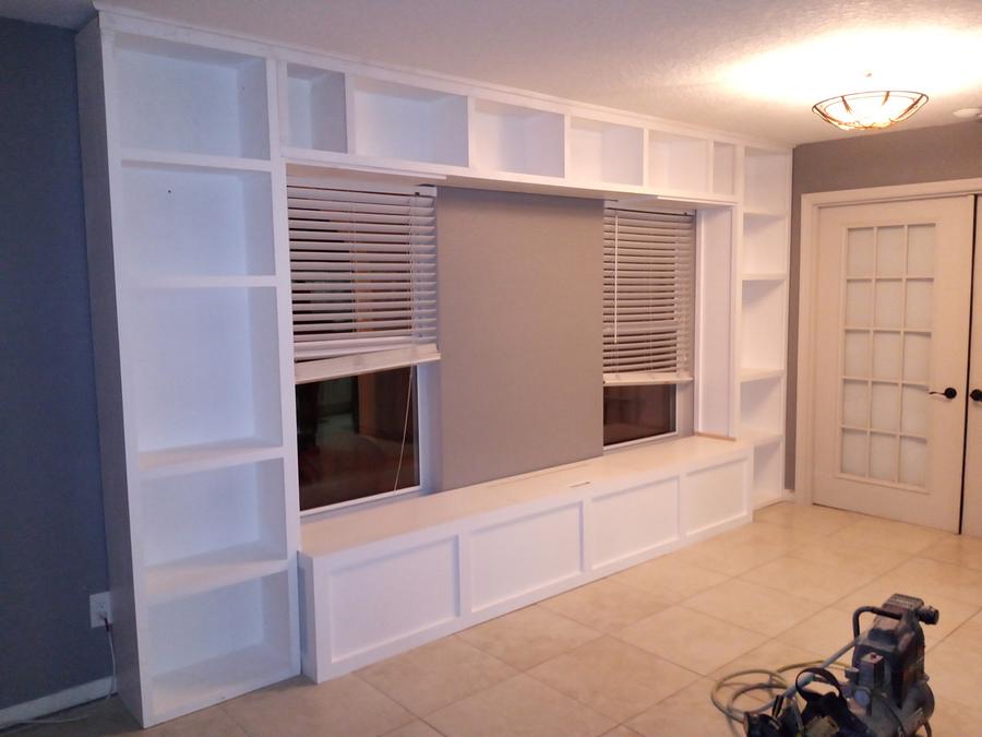 Full Wall Shelving with Storage Bench and Bridge of Cabients