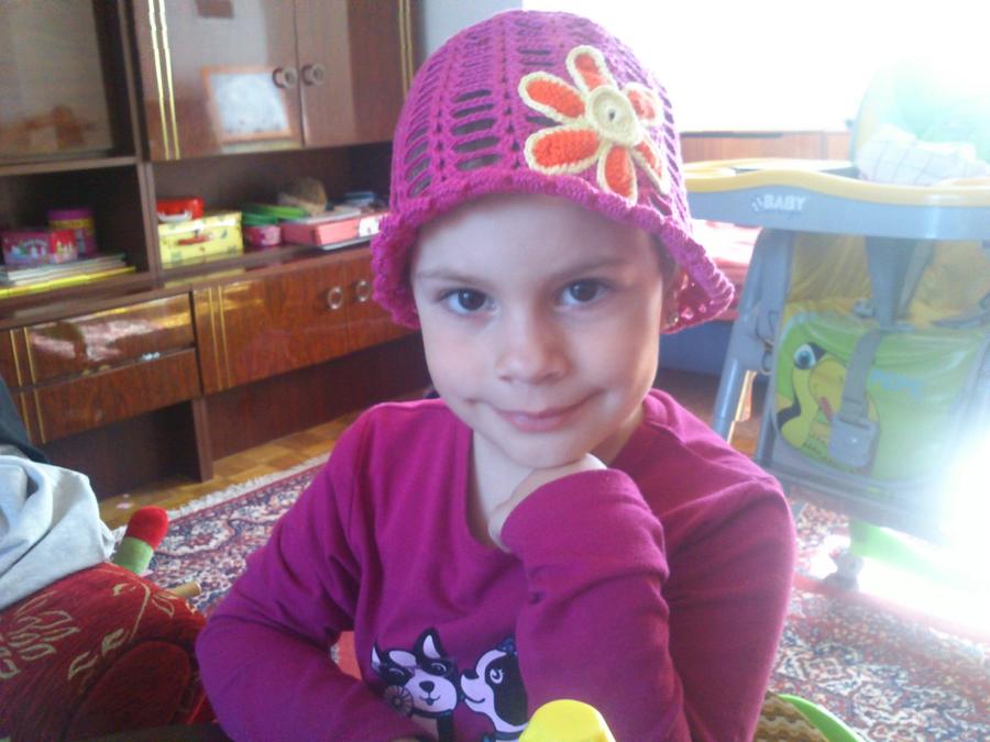 Summer hat with flower and ladybug  