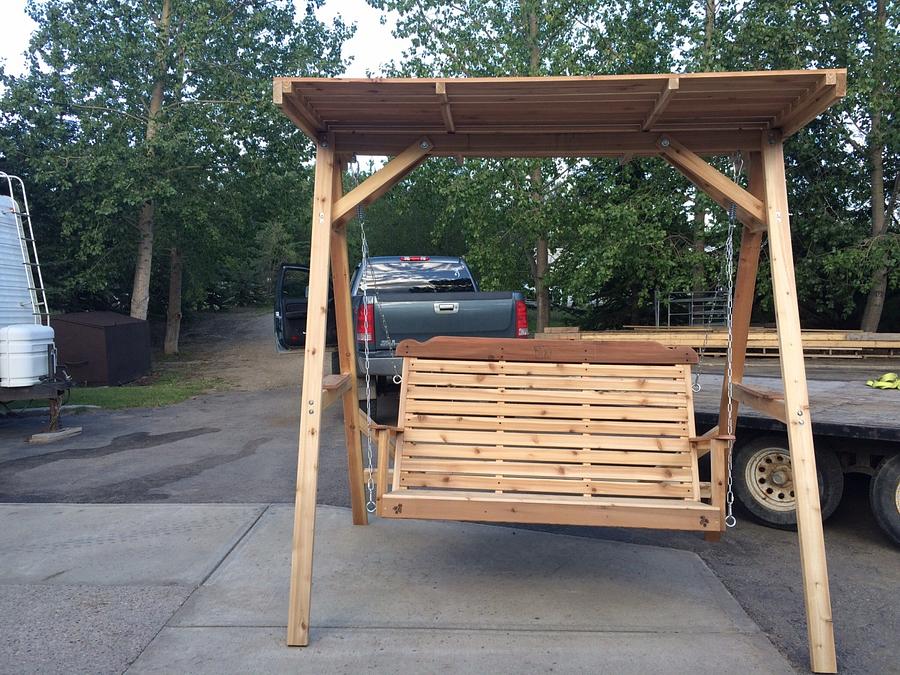 Cedar lawn swing with wood canopy