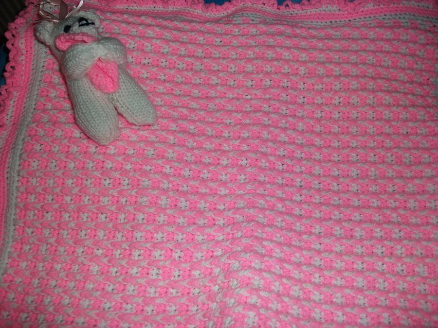 pink and white crochet blanket