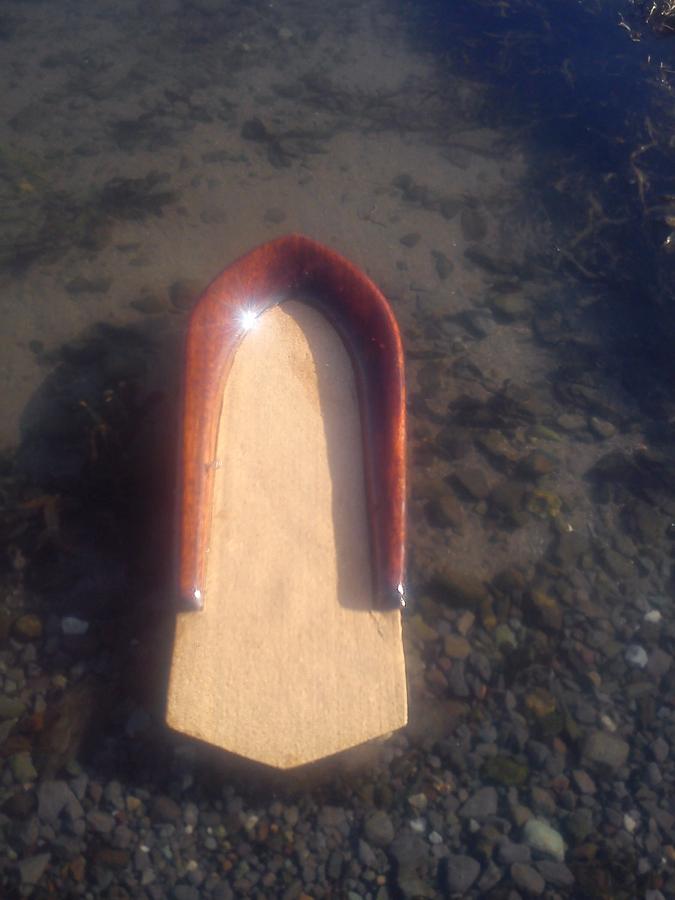 small wooden bodysurf handplane