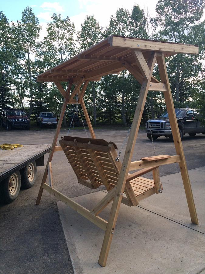 Cedar lawn swing with wood canopy