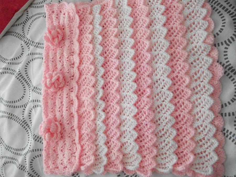 pink and white frilled crochet blanket