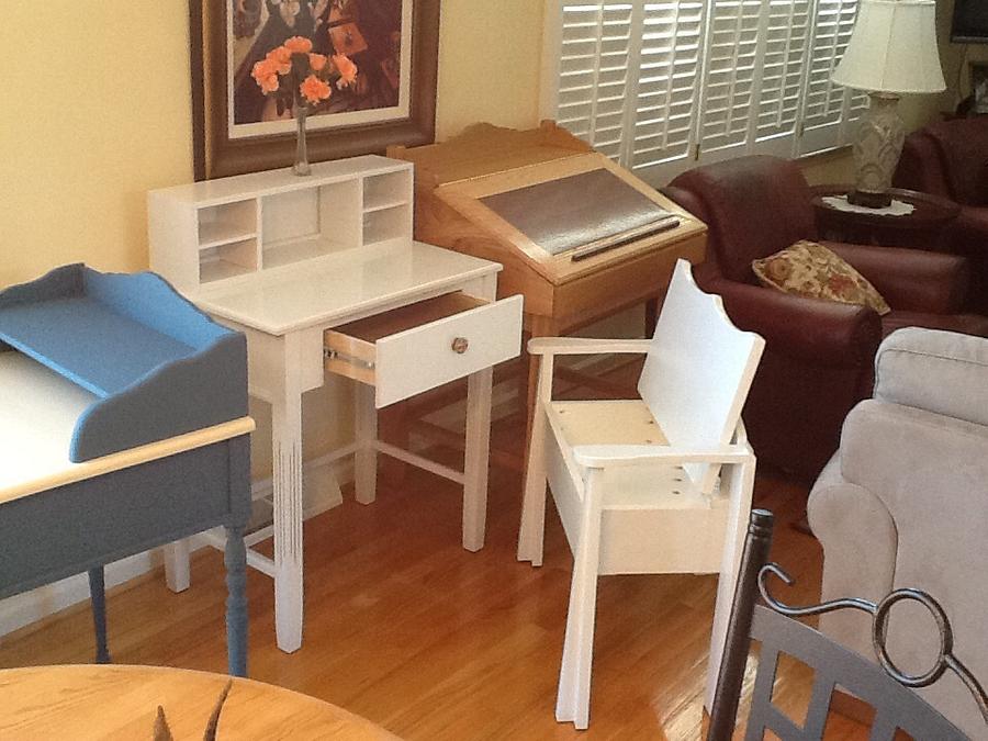 White writing desk with chair, storage in bottom of chair.