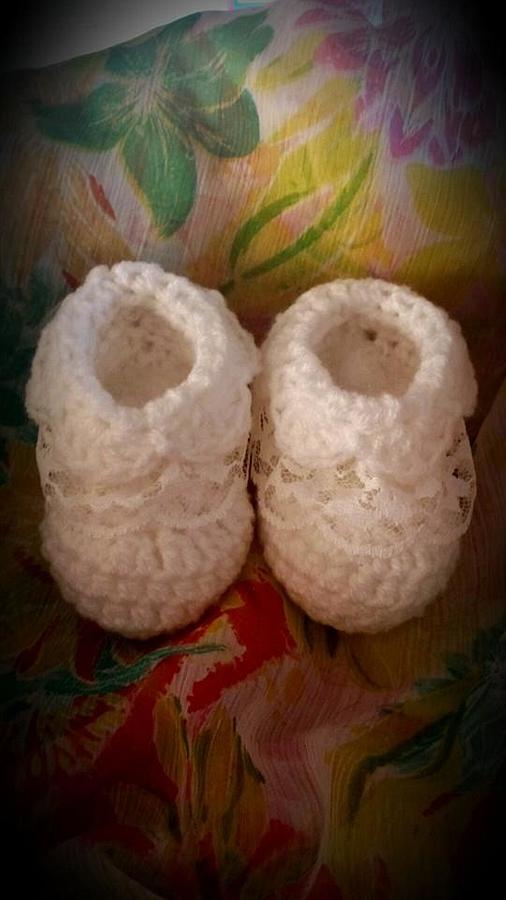 Baby booties with lace detail