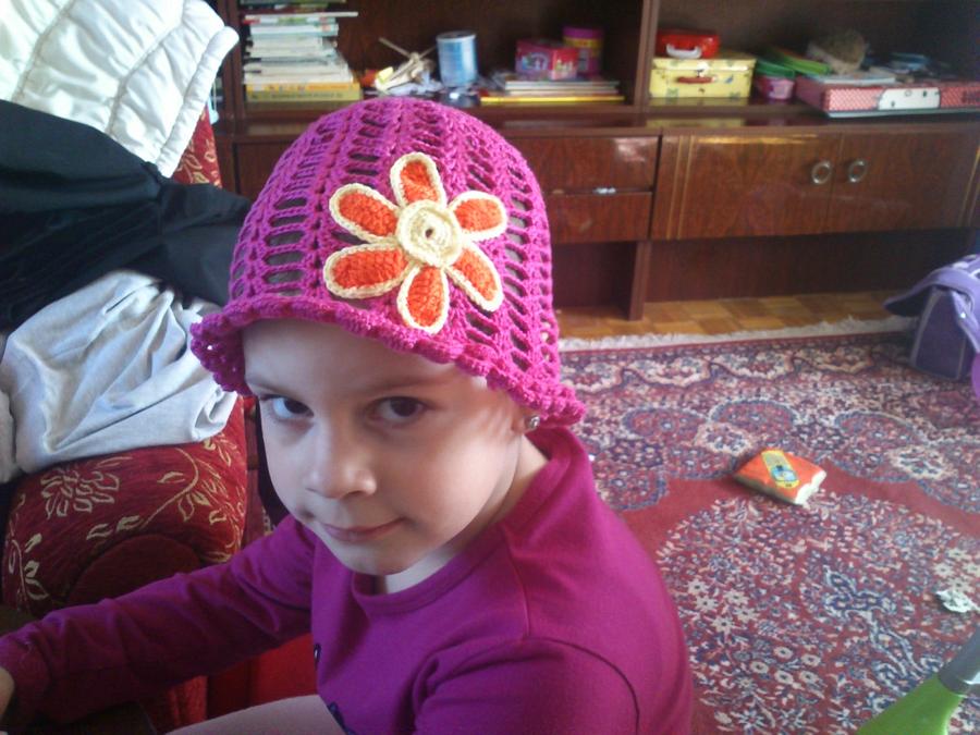 Summer hat with flower and ladybug  