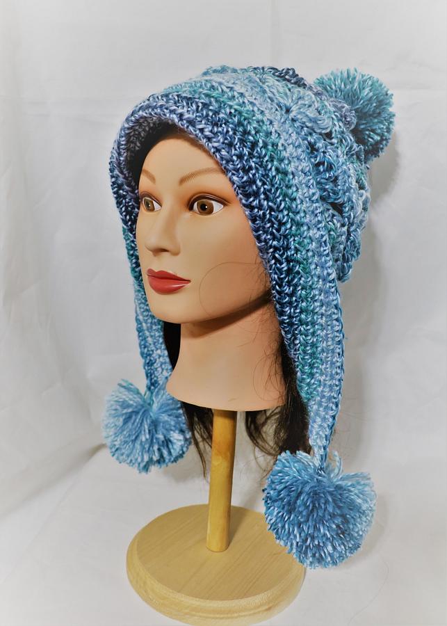 Lacy Pompom Snow Hat featured in Crochet! magazine.