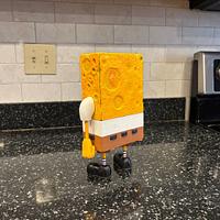 Who lives in a pineapple under the sea?