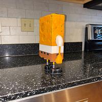 Who lives in a pineapple under the sea?