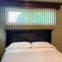 Headboard, with weathered and worn appearance. 