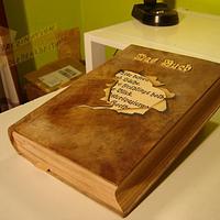 The book, of wood.