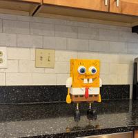 Who lives in a pineapple under the sea?