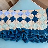 Peacock blue, teal, light blue, and beige entrelac baby blanket