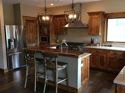 Knotty Alder kitchen Cabinets and Black Walnut live edge counter top - Project by dacabinetguy