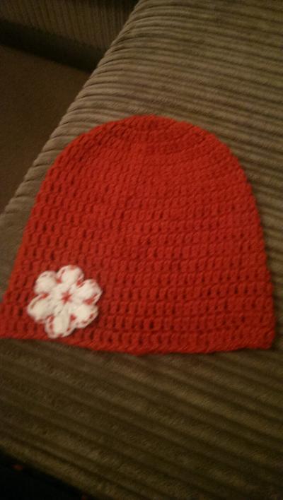 red slouch beanie with flower - Project by maggie craig