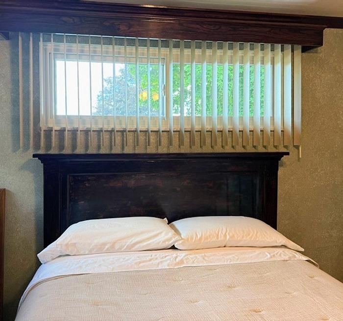 Headboard, with weathered and worn appearance. 
