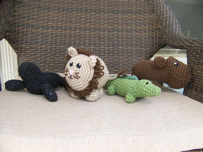 Amigurumi seal, lion, alligator, and hippo