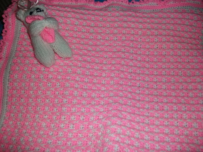 pink and white crochet blanket