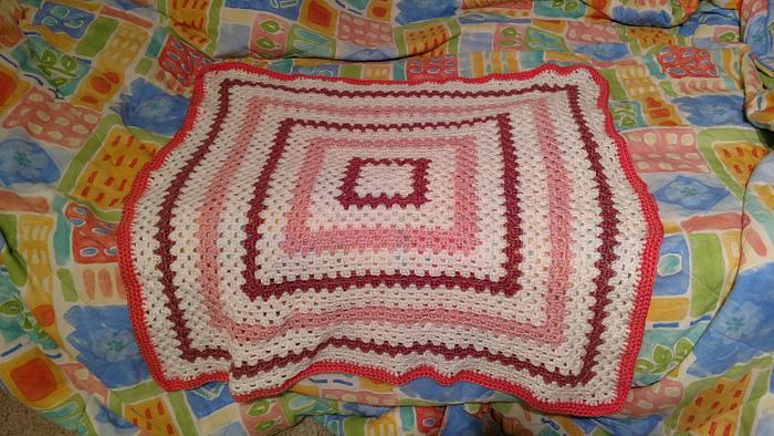 Pink and white baby blanket