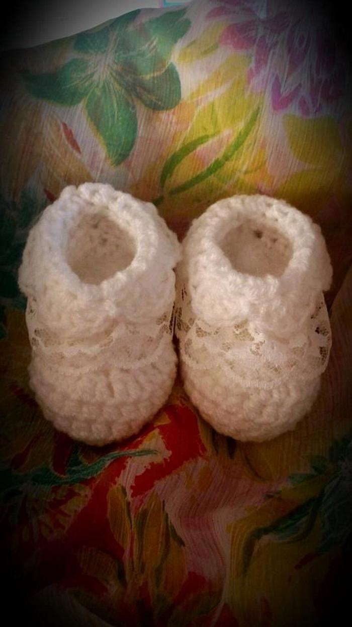 Baby booties with lace detail