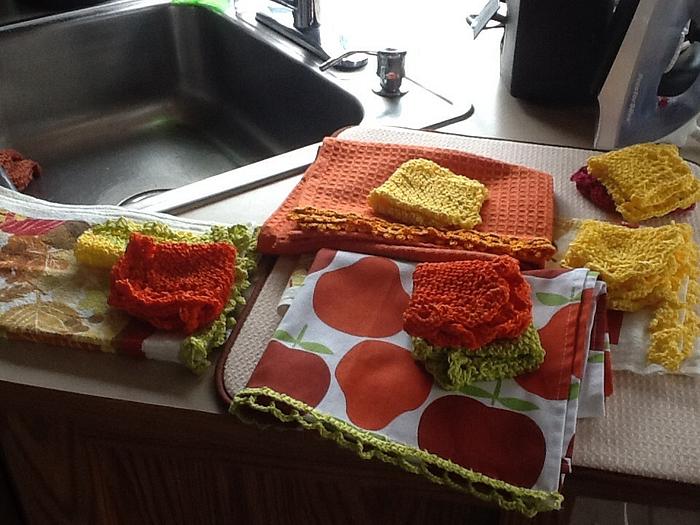 Crocheted edgings on t towels and cotton face cloths