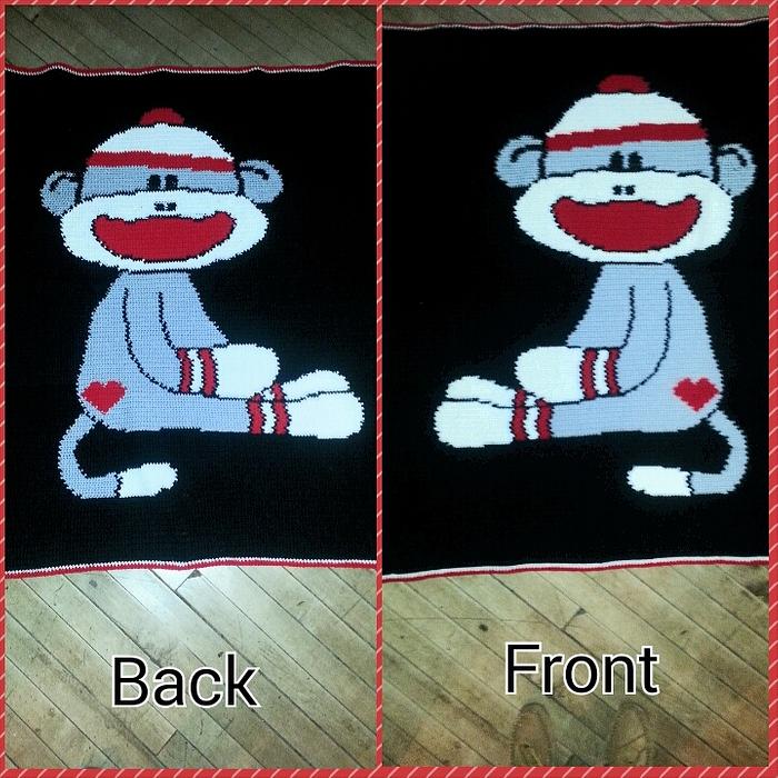 crocheted reversable Sock Monkey Blanket
