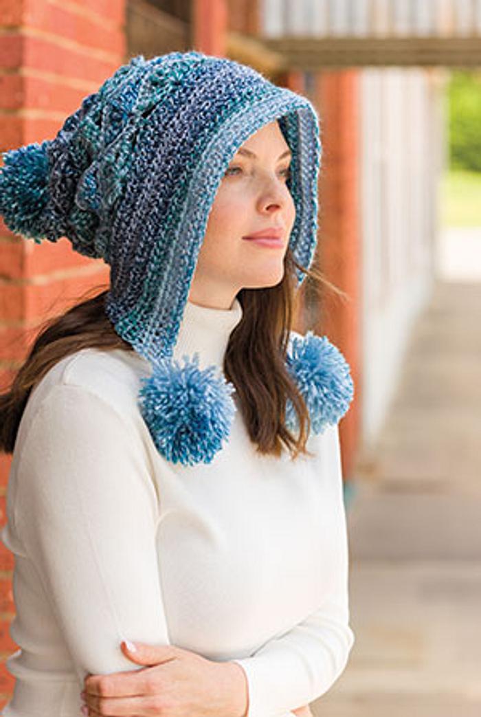 Lacy Pompom Snow Hat featured in Crochet! magazine.