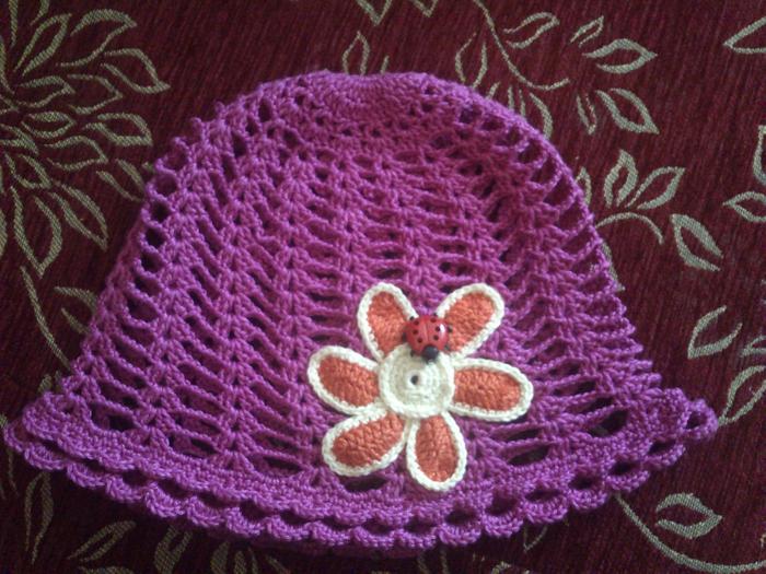 Summer hat with flower and ladybug  