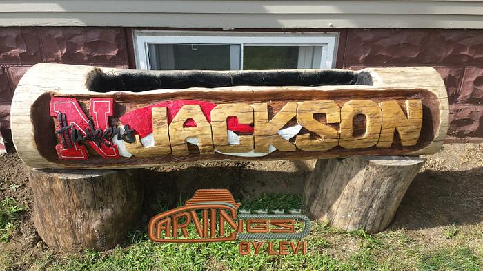 chainsaw carved log sign